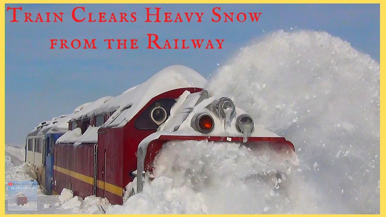 Train Clearing Heavy Snow from the Railway Train Snow Blower Heavy