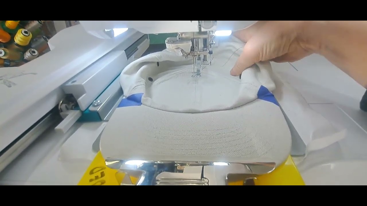 Babylock  Solaris 3(Vision)-playing on a Radiance with a DIME hat hoop and hoop clip to embr a hat. 