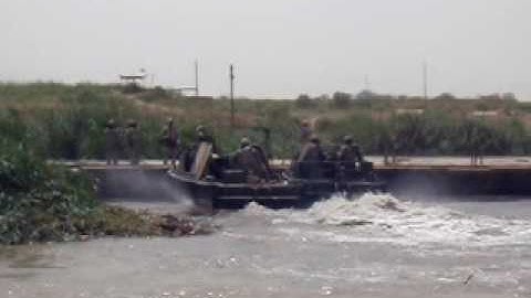 Army 12C engineers and MK2 BEBs working on ribbon bridge on Tigris River, Iraq - July 2009