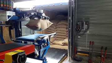 Unloading coffee bags from a container plus palletizing