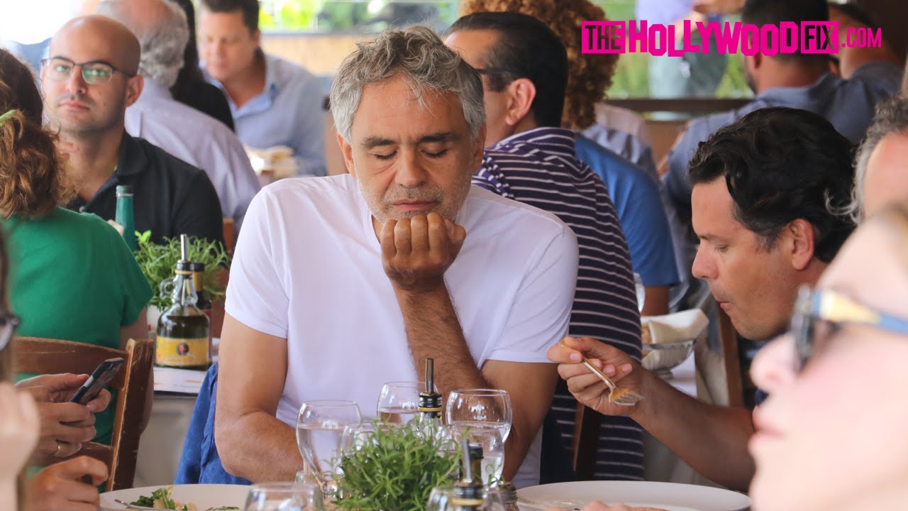 Andrea Bocelli receives a gift while eating lunch in Beverly Hills 