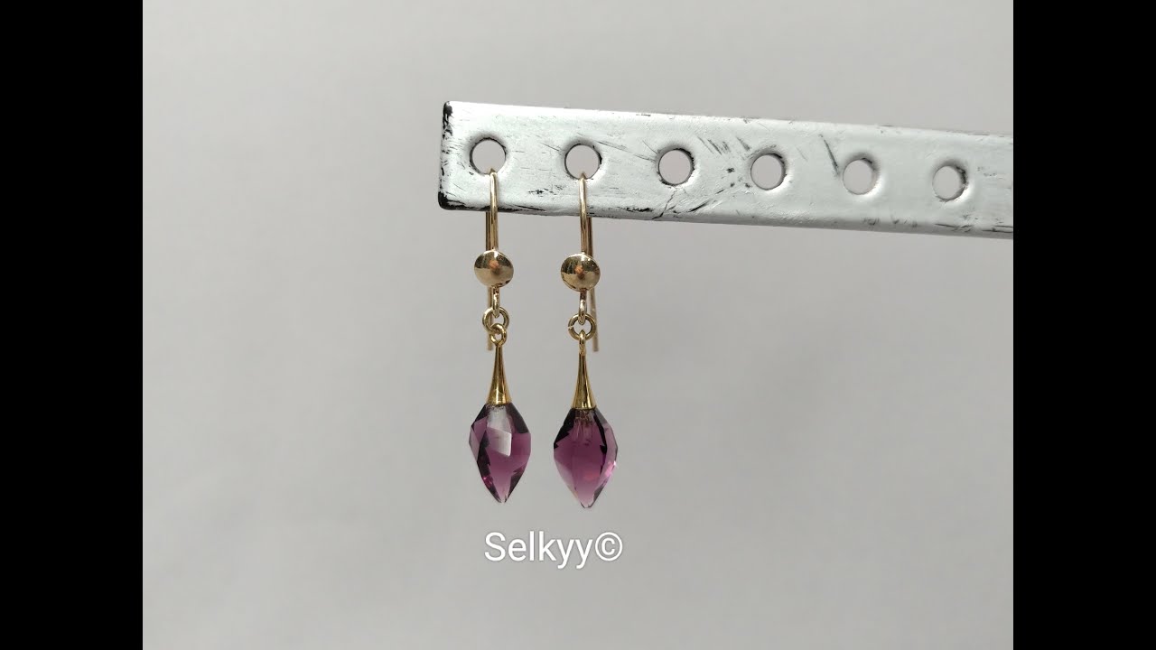 Boucles d’oreille pendantes en Goldfiled 14K et Twisted Drop en cristal de Swarovski améthyste