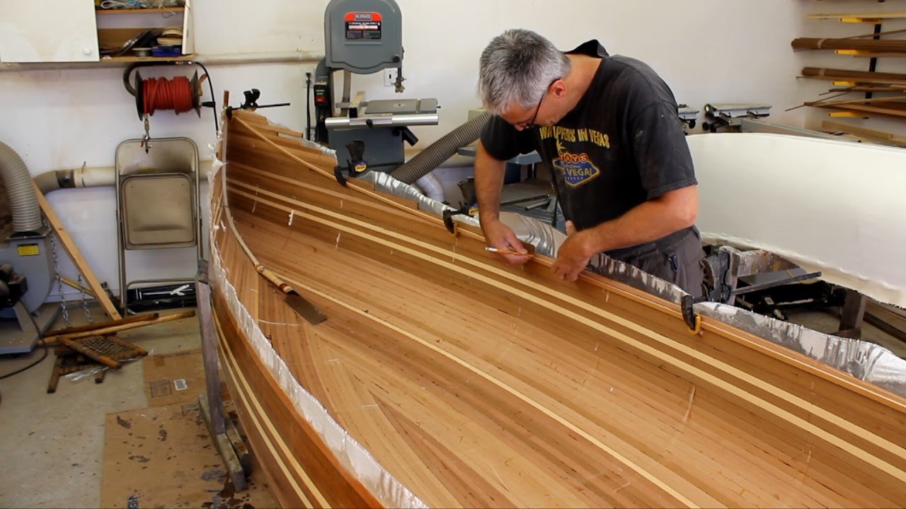Cutting the sheer line on a cedar strip canoe - YouTube