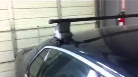 Volkswagen Jetta Sedan with Thule Traverse Roof Rack by Rack Attack