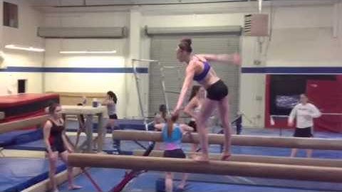 Switch leap switch leap straddle jump (beam)