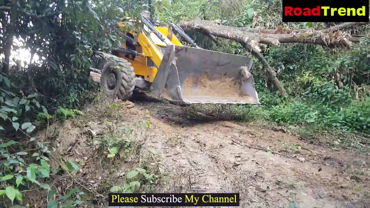 JCB Backhoe pushing big  tree in Jungle  - Hill side Jcb video.