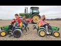 Using kids tractors to plow up hidden toys in dirt | Tractors for kids