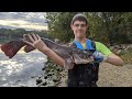 Releasing a 31 inch 11 pound Flathead Catfish