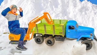 Darius rides on Tractor excavator and helps RC Car from snow storm | Video for kids