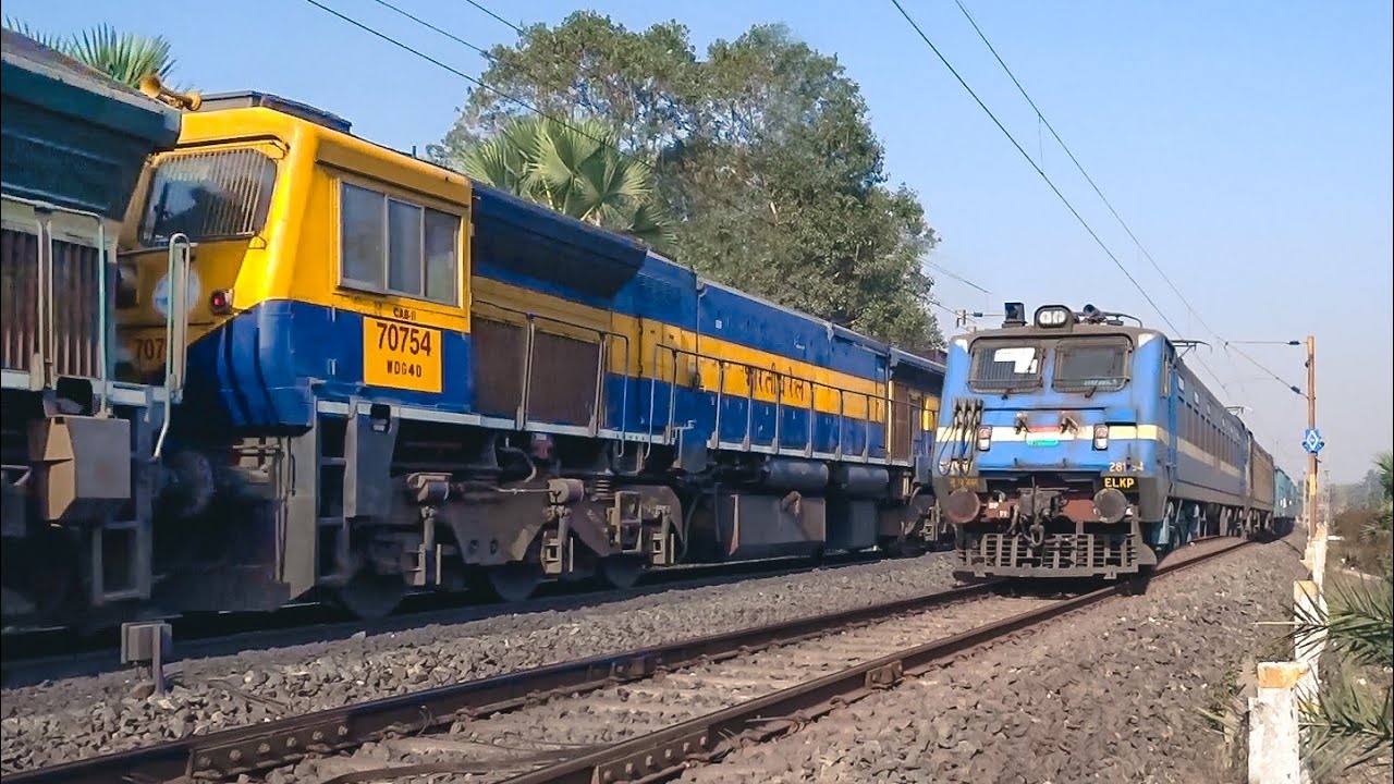 Dangerously speedy twin Diesel loco powered train meets twin electric loco powered freight train