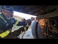 Mobile service tech torching  straightening a mudflap bar on semi trailerdieselmechanic  diesel