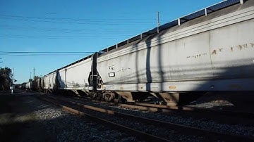 CSX 302 & 5449 lead SB Grain loads on the old pere Marquette