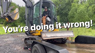 How to load a mini excavator on a tilt deck trailer