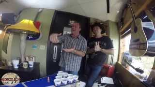 Bob Cole and Eric Raines get a lesson from Thom Shepherd on Beer Pong