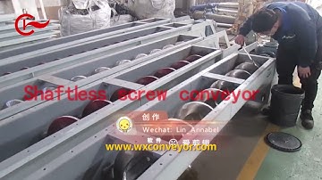 Shaftless screw conveyor transporting screens in sewage treatment plant