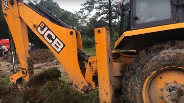 JCB Backhoe 3DX Machine Making Drain and Loading Soil in Tractor