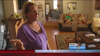 Woman holds burglary suspect at gunpoint until police arrive