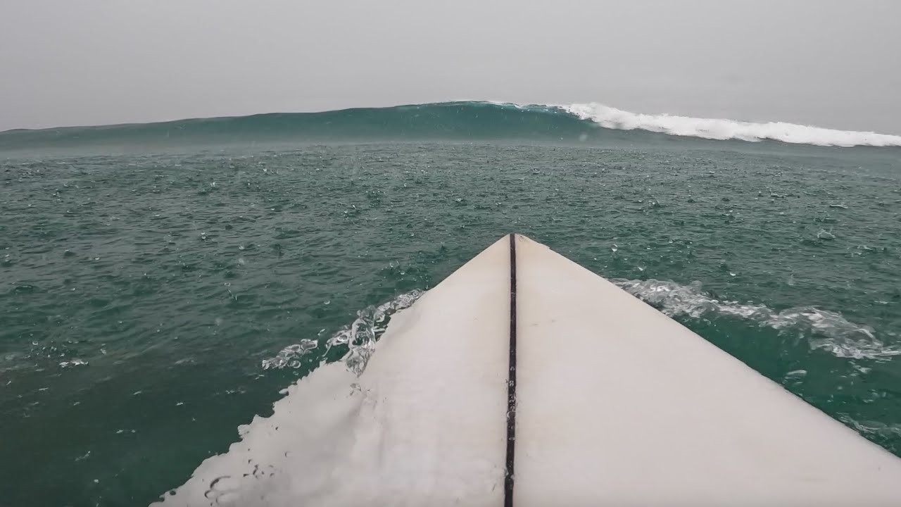 SURFING IN THE POURING RAIN IN NEW ZEALAND! (RAW POV)