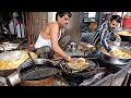 Hardworking man making gathiya with hands - Indian Street Food