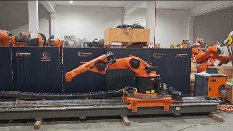 KUKA KR30-3 Industrial robot on track and two rotary positioners at Eurobots
