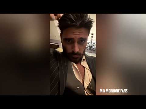 Michele Morrone in a pinstripe suit