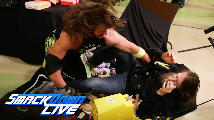 AJ Styles drives Daniel Bryan through a concession...