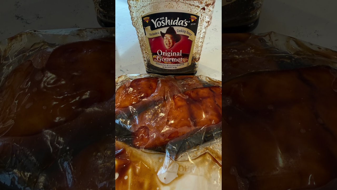 Baked salmon marinated in Mr. Yoshida’s over a bed of white rice and peas 