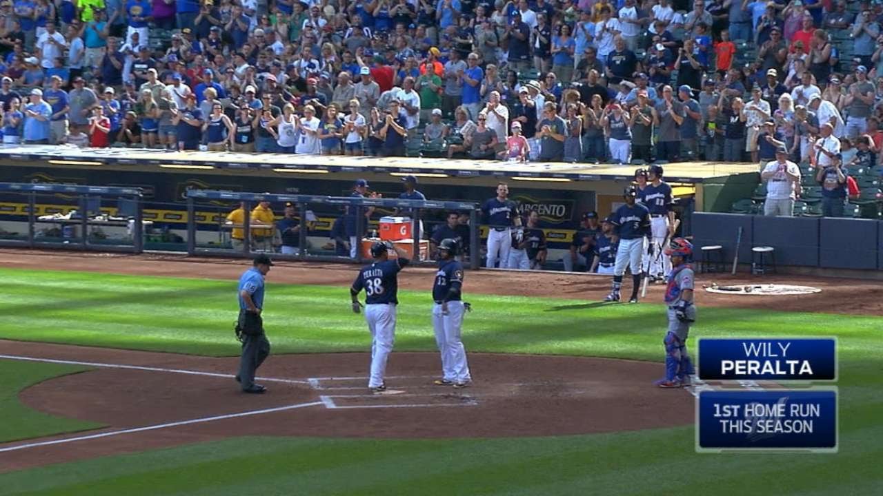 Pitcher Wily Peralta helps his cause, hits first home run