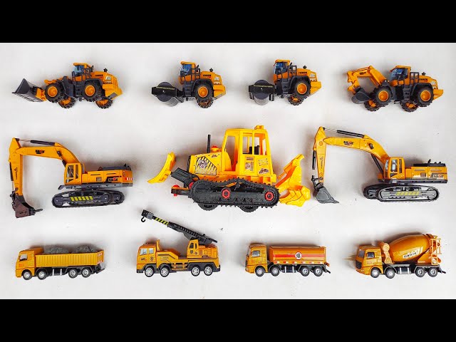 construction vehicles, there are bulldozers, road roller, dump truck, Excavator, tanker truck. class=