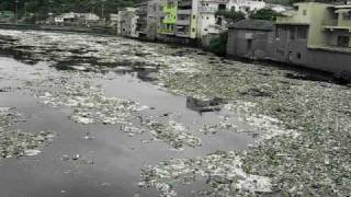 2 - Wastewater Pollution - Garbage and Trash floating in the Tiete River - Brazil.