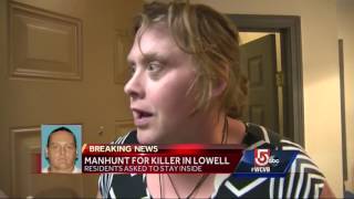 Heavily armed officers search neighborhood for suspected killer