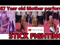 87 years old mother performs stick fighting