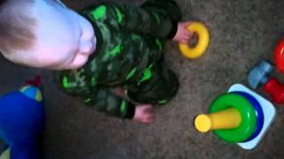 My smart boy & his stack 'em toy!