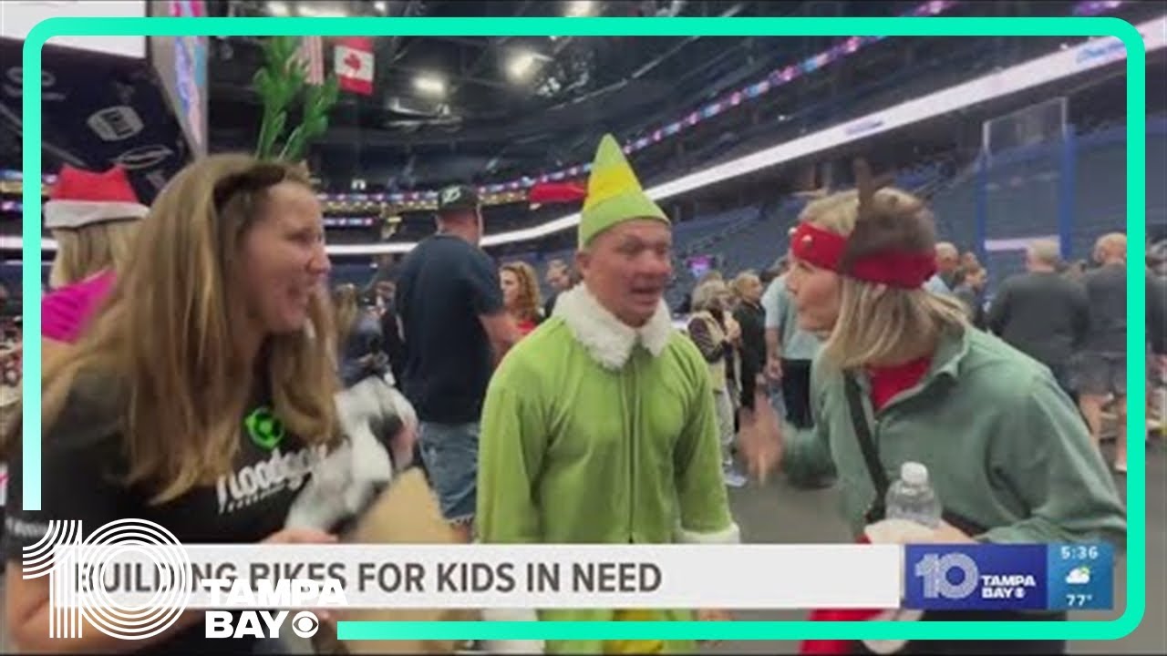 Volunteers from onbikes build more than 1,000 new bikes at Amalie Arena for kids in need