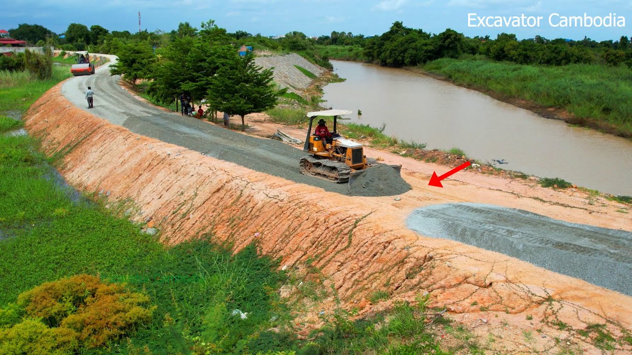 Amazing Showing Bulldozer Spreading Gravel Making Long Road Along The River - Dozer Building Road