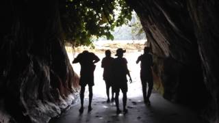 Walking through a cave on a beach near Nuqui