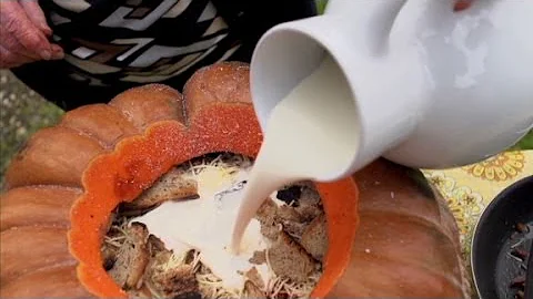 Bourdain enjoys a winter dish at Chef Boulud's far...