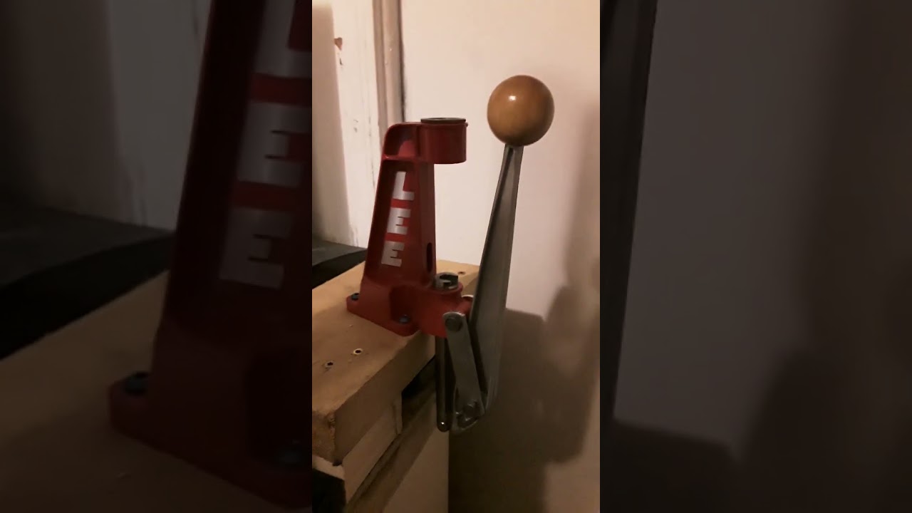 The LEE single stage press on a DIY makeshift stand, a frugal yet effective solution for reloading.