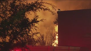 Brush fire burns in riverbed in Santee