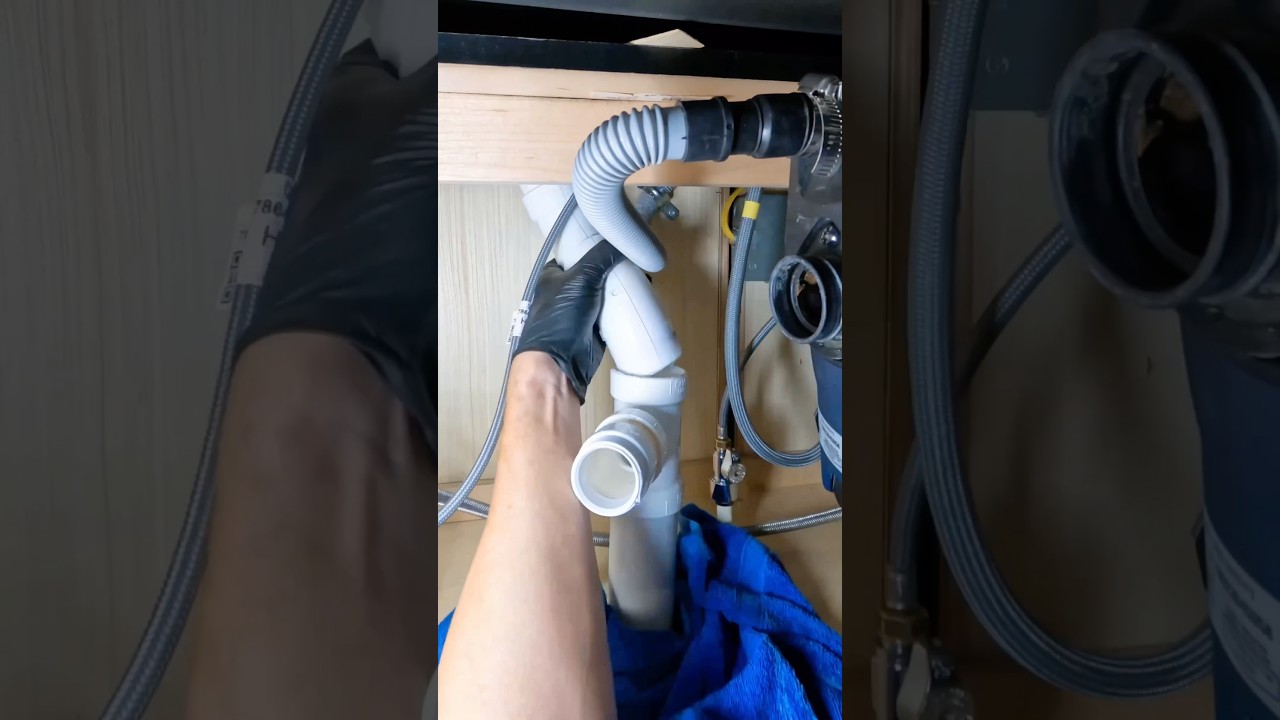 Repiping PVC drain and disposal under a kitchen sink 💦 #plumbing #plumber #asmr #diy
