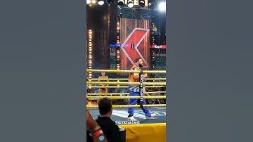 DJ Khalid hyping up the crowd during a boxing match