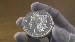 Showcasing of 1 oz Kennedy Concave Proof Silver, 2 oz Morgan Round, 1 oz Silver Water Dragon