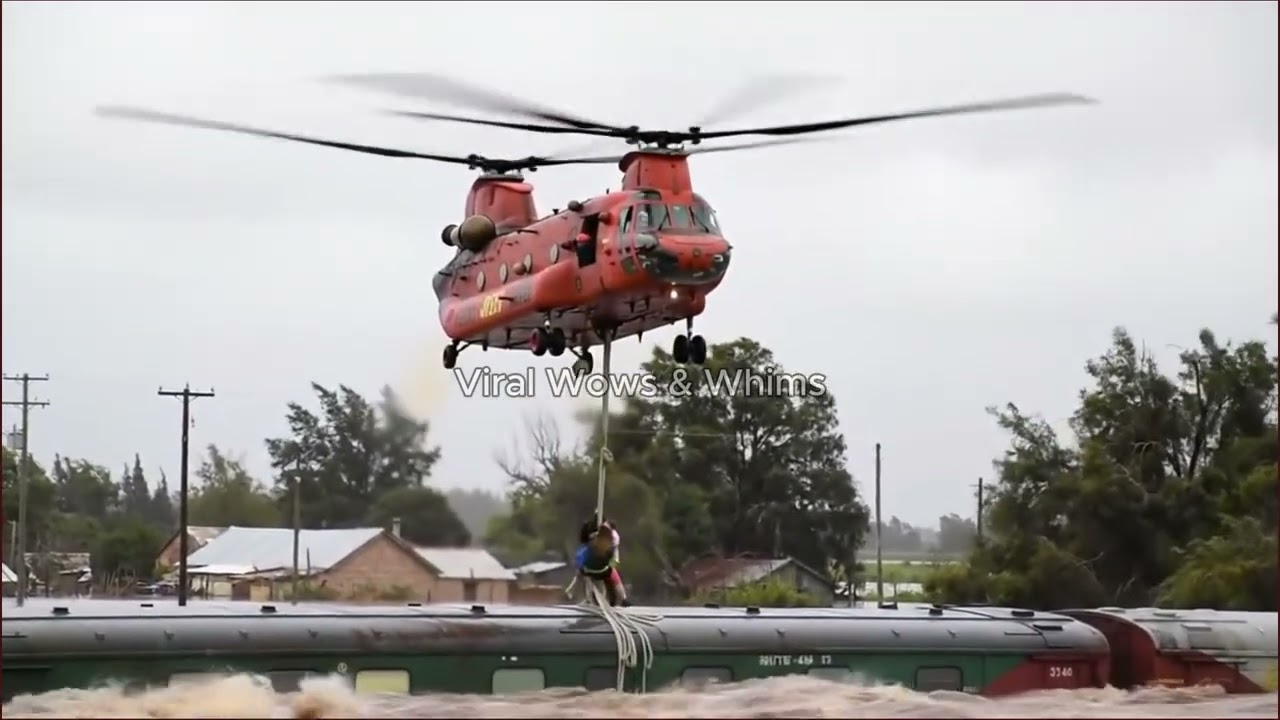 Red Chinook Helicopter Rescues Woman & Family from Train Roof in Village Flood! 