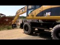 Cat® Wheel Excavators with Attachments in Action