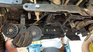 Replacing the transmission drive belt and the 2 tensioner pulleys on a John Deere tractor