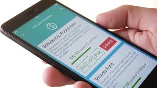 Making Charity Donation To Educational Organization Using Smartphone App | Stock Footage - Videohive screenshot 1