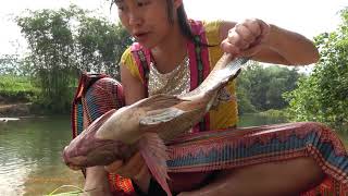 Survival Skills - Smart Girl's Catching Big Fish By Primitive Skills At River - Cooking Big Fish