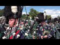 Massed Pipes & Drums afternoon display during the 2019 Aboyne Highland Games in Deeside Scotland