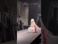 Doja Cat getting up to help thr model that fell at the valentino couture show in paris