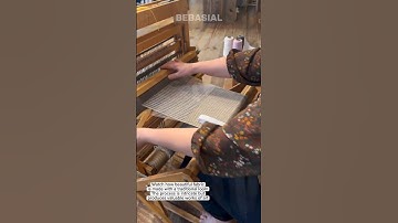 The Process of Weaving Fabric with a Traditional Loom